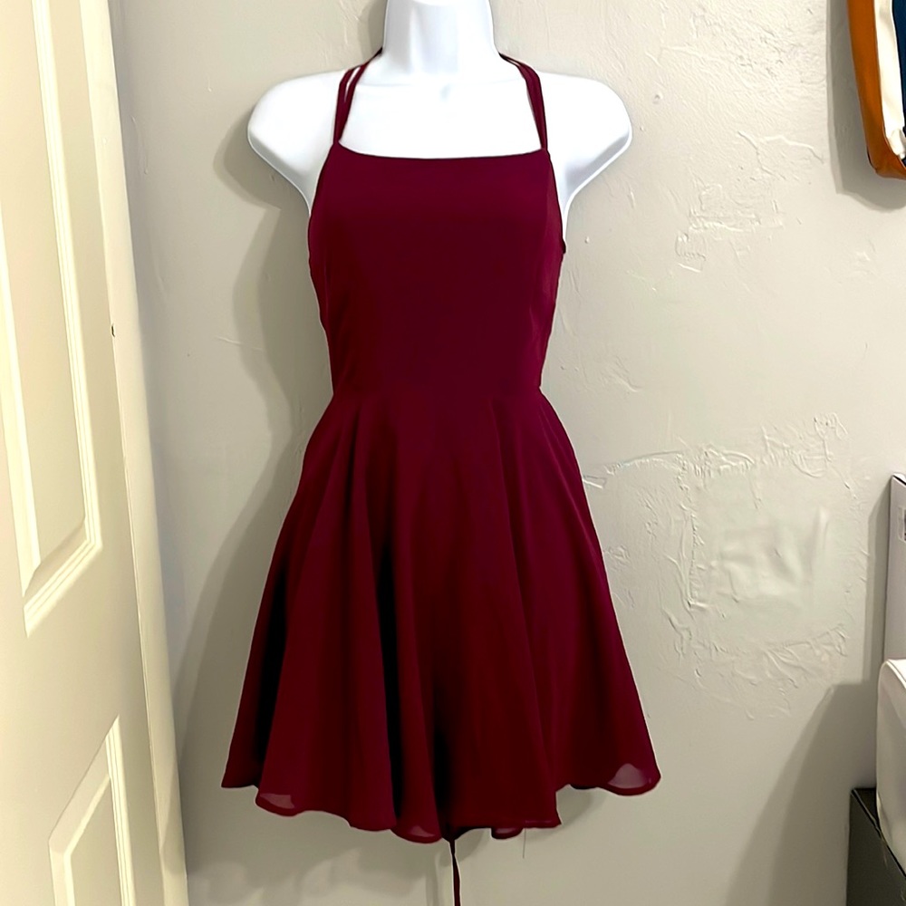 Burgundy flowy dress with straps on an open back